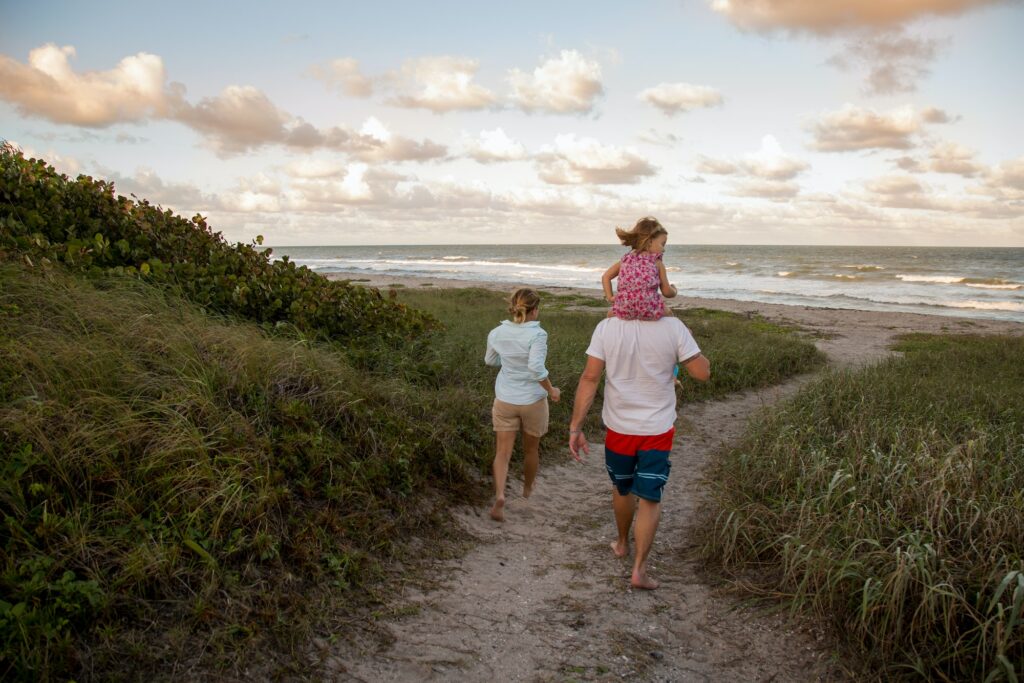 Family walking on coastal path, Blowing Rocks Preserve, Jupiter, Florida, USA