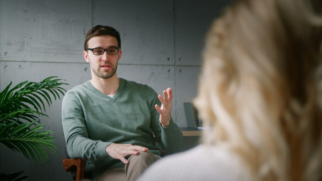 The psychotherapist explaining the plan to the patient